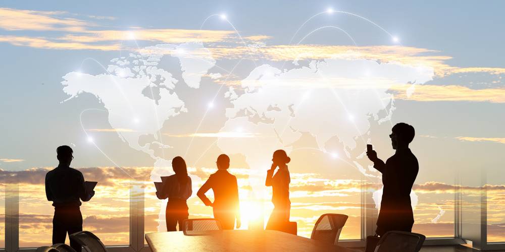 A leader inspiring a diverse team toward a shared vision